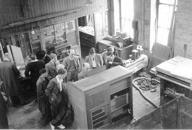 The workshop of organ builder Peter Conacher in 1952, the firm where the founder of Wood Organ Builders started his career.