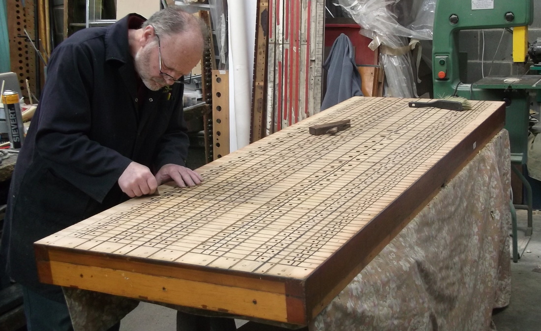 Paul Rayner at work on restoring a soundboard from the Binns organ in Christ Church, Great Ayton