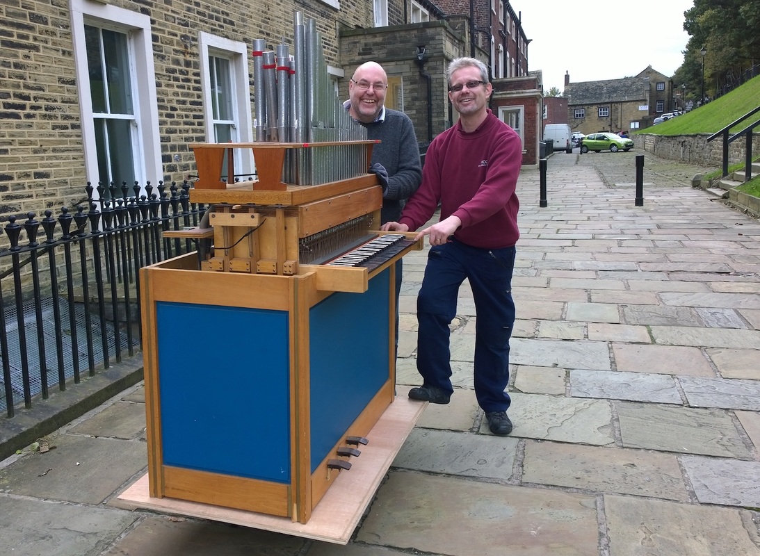 A chamber organ is wheeled into Fulneck Moravian Church, Pudsey.